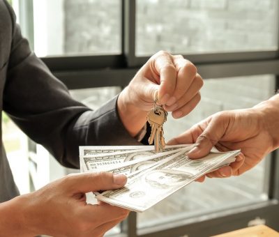 Home business concepts,Buyers and sellers give dollar money,Sellers give keys.