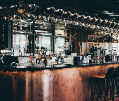 wide-shot-bottles-glasses-display-cabinet-bar-scandic-hotel-copenhagen-denmark